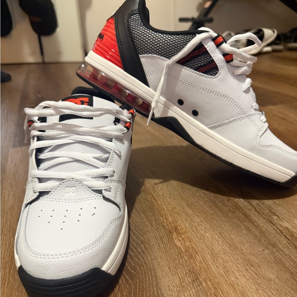 DC Versatile White and Black Sneakers with Red Accents